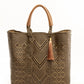 Brown and tan chevron woven bucket bag made from recycled plastics and featuring a tan leather handle and tassel detail