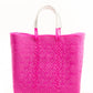 Hot pink woven bucket bag made from recycled plastics featuring a white leather handle