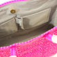 Light gray lining of hot pink woven bucket bag with two pockets and magnetic closure