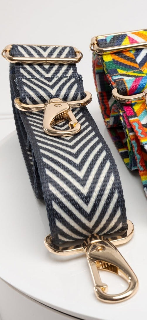 Full line of Coba purse straps in a row