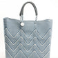 Blue and white chevron tote bag made from recycled plastics featuring a blue handle and silver Coba logo medallion