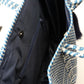 Inside navy blue and white tote with navy blue lining, zipper pocket, and magnetic closure