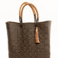 Brown and tan woven handbag made from recycled plastics featuring tan leather handles and tassel detail