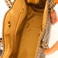 Inside tan lining with zipper pocket and magnetic closure of brown and tan chevron woven bucket bag made from recycled plastics