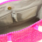 Light gray lining of hot pink woven bucket bag with two pockets and magnetic closure