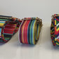 Video of 3 colorful purse straps in a row
